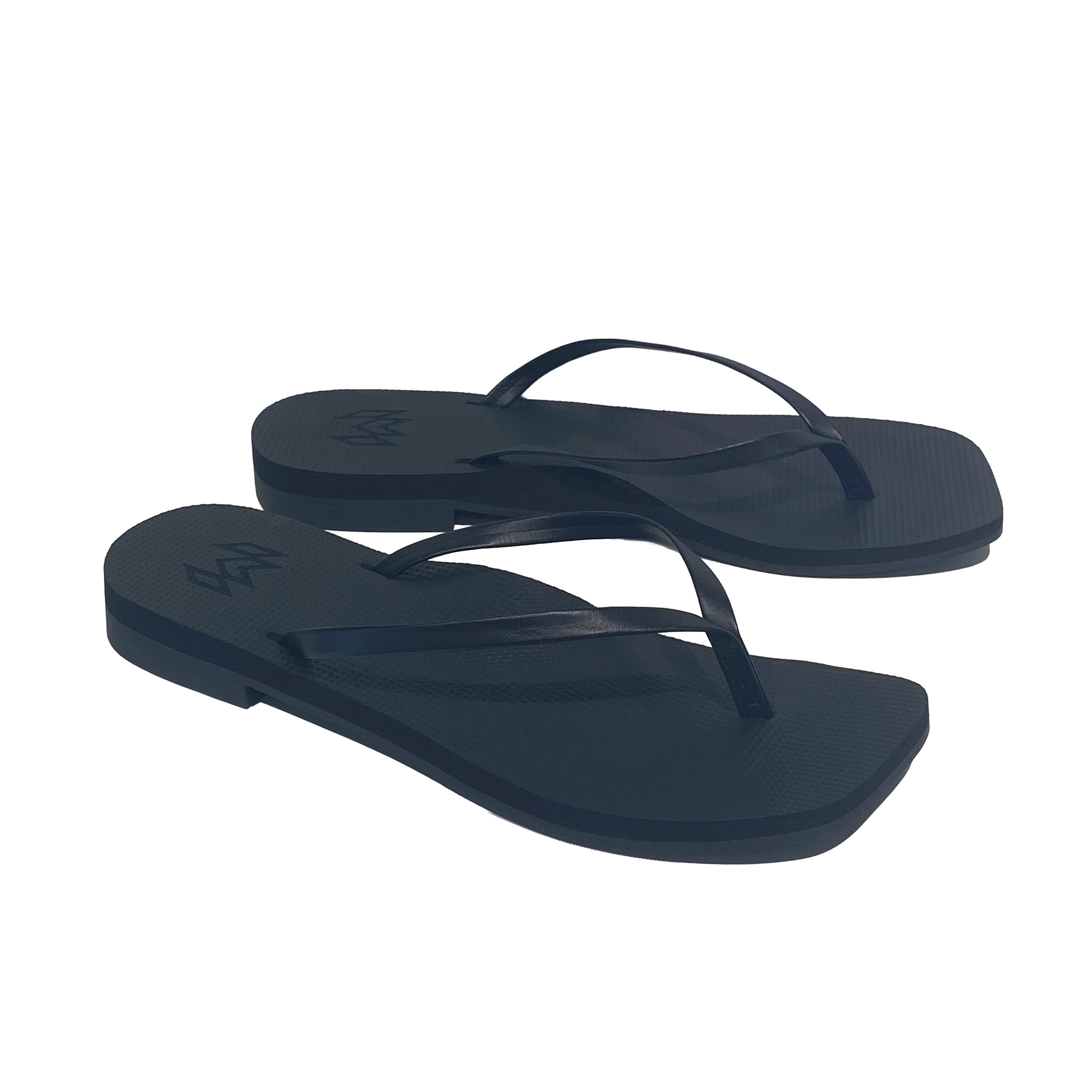 black flip flops with a square toe