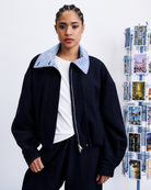blue jacket with plaid collar