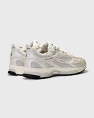 white sneakers with mercer branding on the side