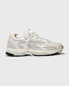 a white sneaker with mercer branding on the side