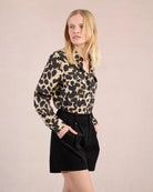 Woman wearing black high waisted shorts