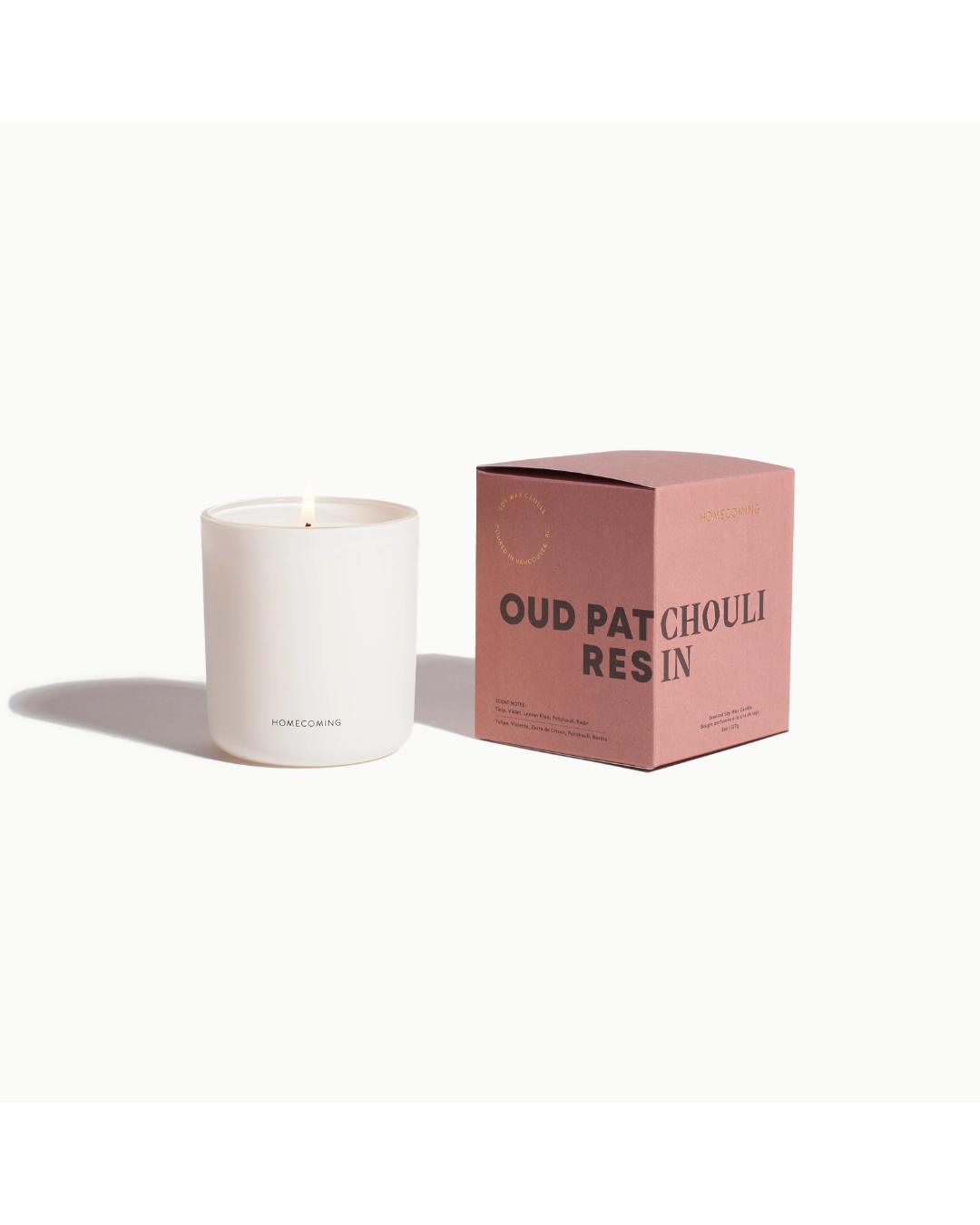 white candle with a pink box