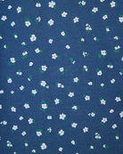 Blue fabric with small white floral pattern