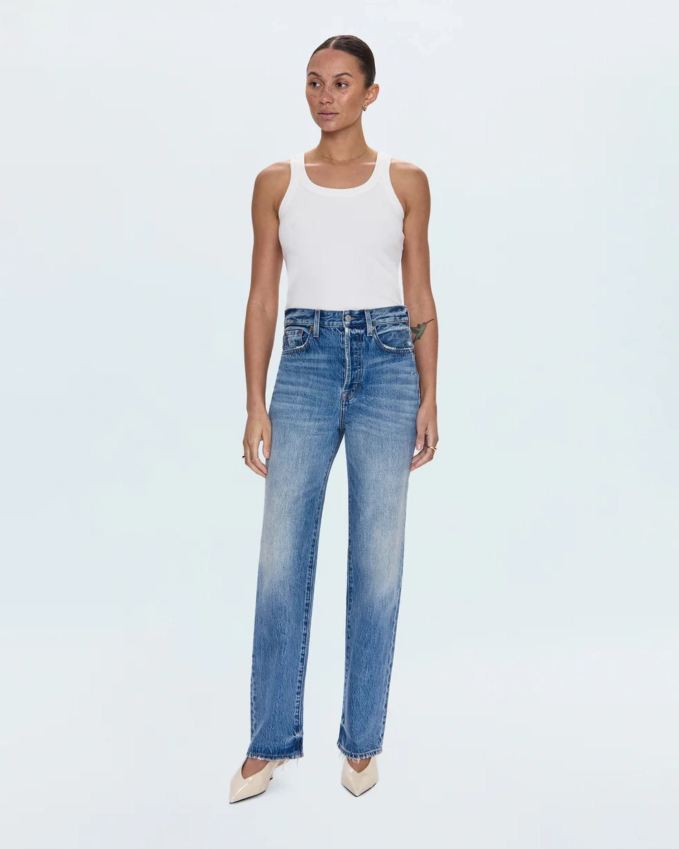 a woman wearing high rise straight jeans from Pistola