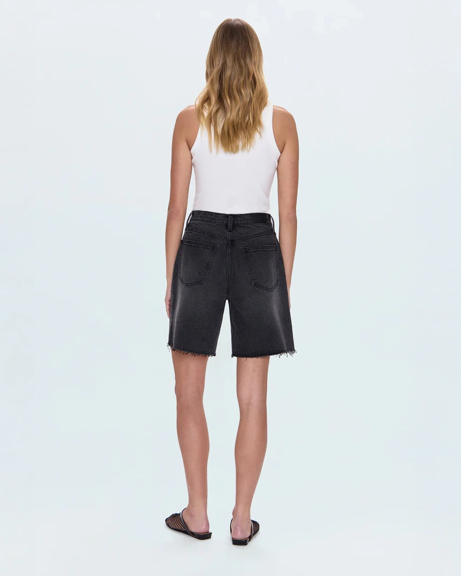 woman wearing black denim shorts