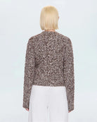 a woman wearing a cable knit fisherman sweater by Pistola 