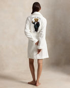 a short cotton terry bathrobe with the polo ralph lauren logo on the chest and a large bear embroidered on the back