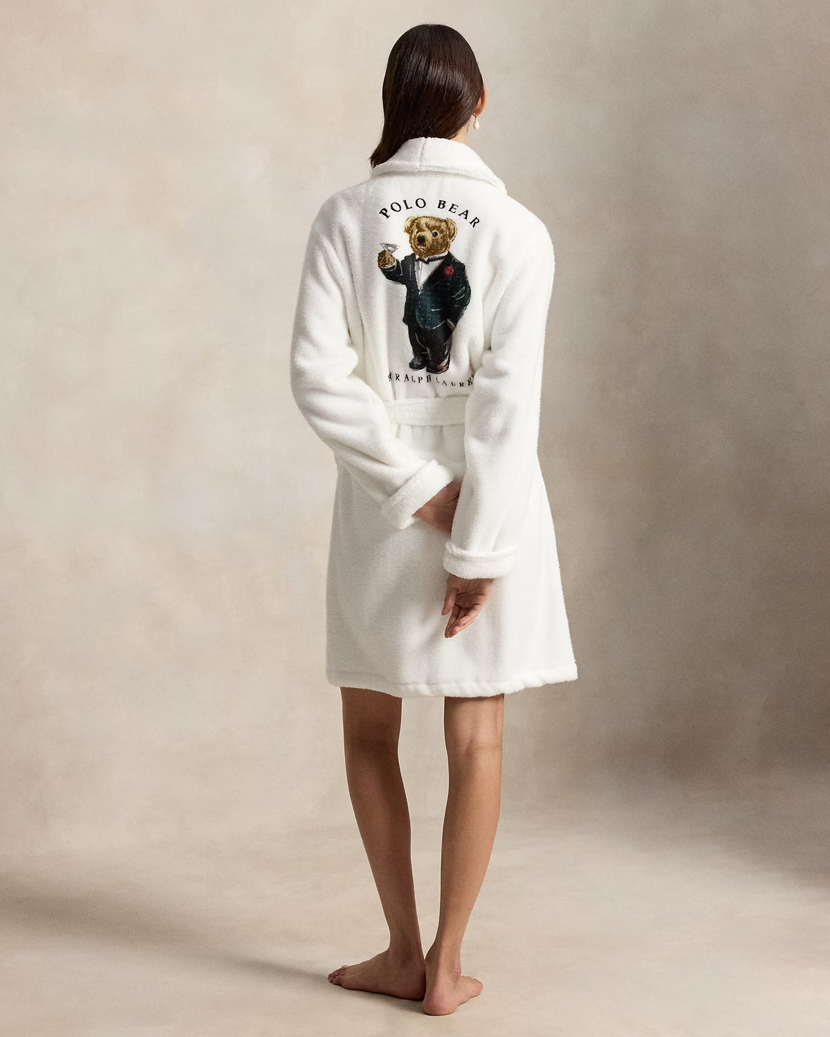 a short cotton terry bathrobe with the polo ralph lauren logo on the chest and a large bear embroidered on the back