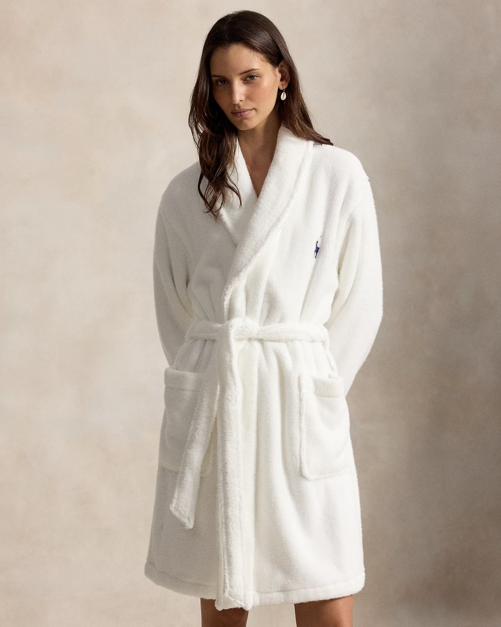 a short cotton terry bathrobe with the polo ralph lauren logo on the chest and a large bear embroidered on the back