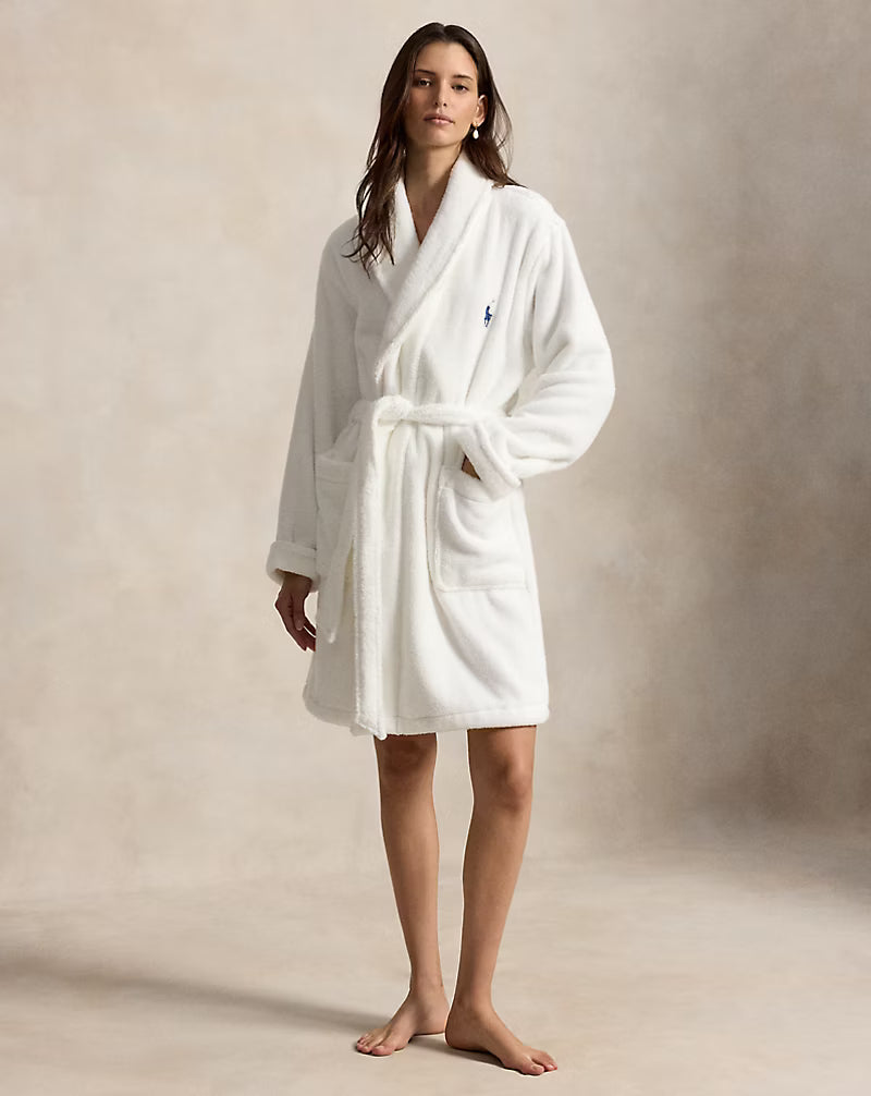 a short cotton terry bathrobe with the polo ralph lauren logo on the chest and a large bear embroidered on the back