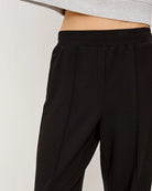 a pair of pleated black elasticated pants by Rails