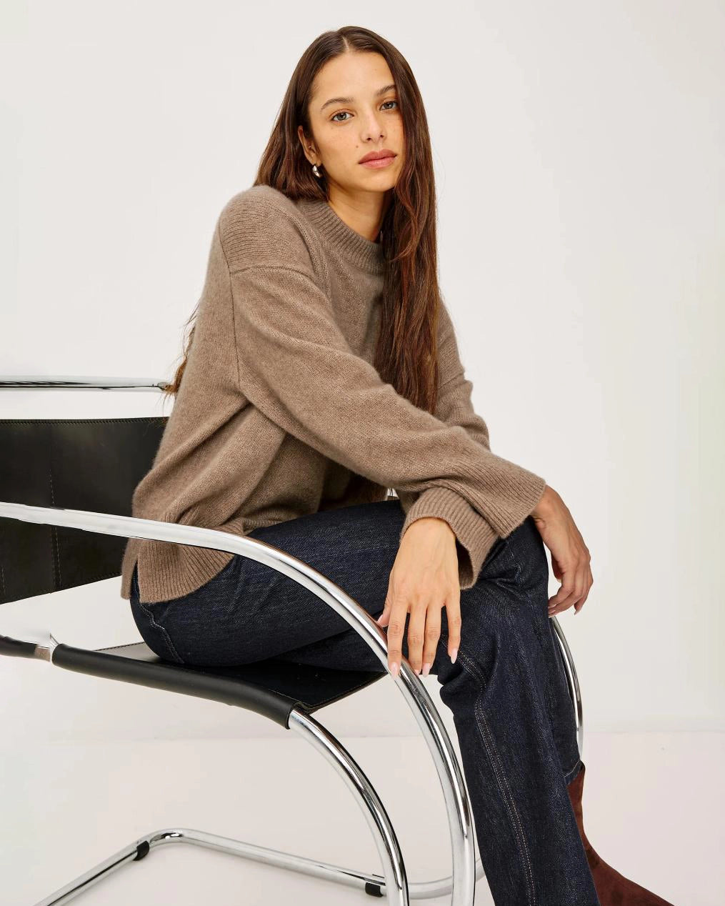 a woman wears a brown cashmere sweater 