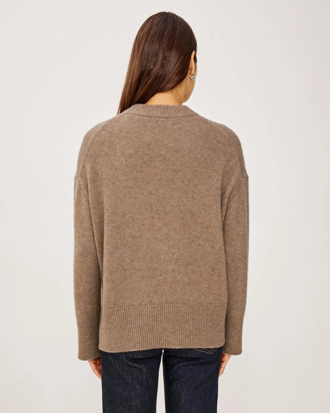 a woman wears a brown cashmere sweater 
