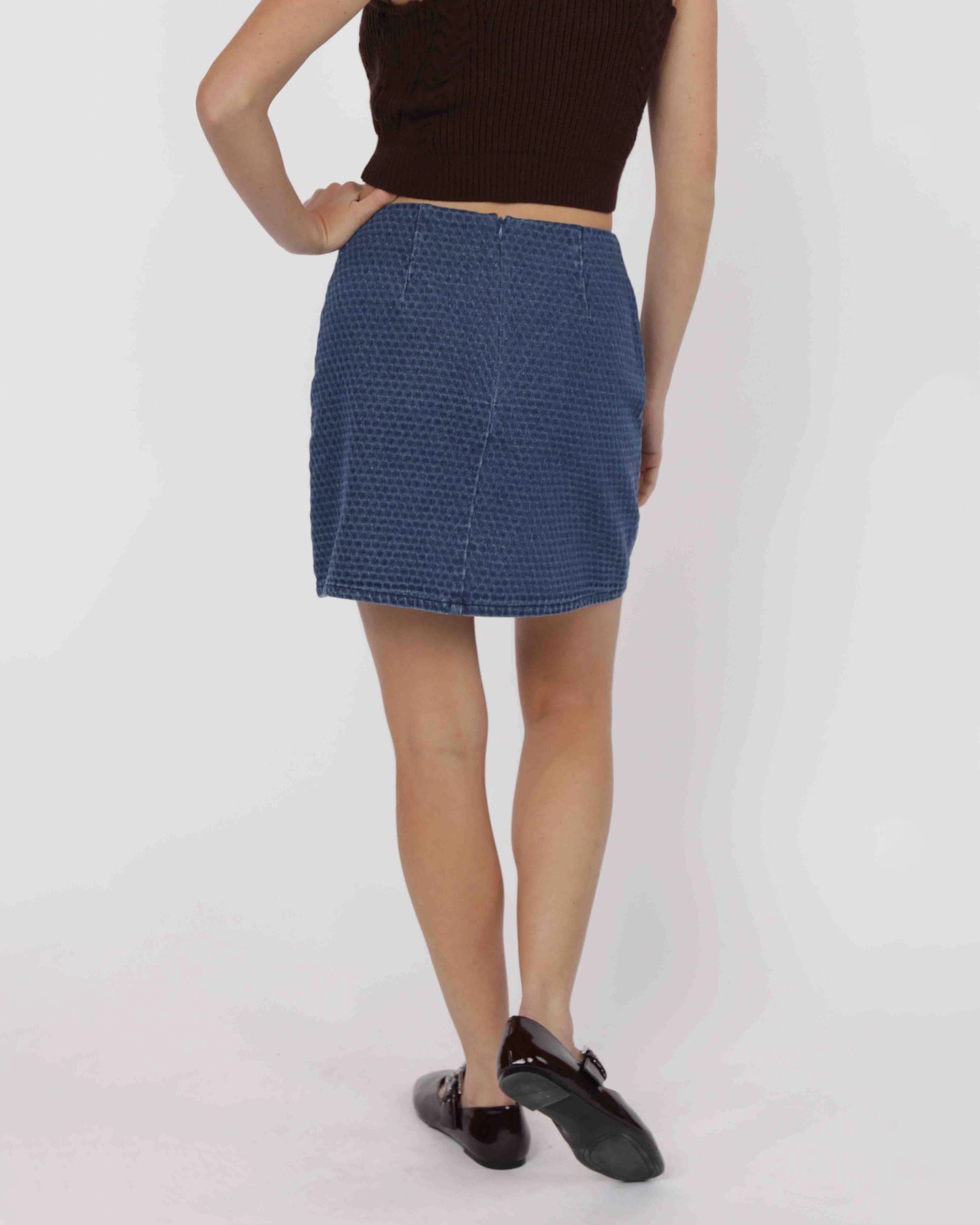 woman wearing a blue patterned denim skirt