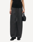 woman wearing grey high-waisted Saroko pants by Samsøe Samsøe