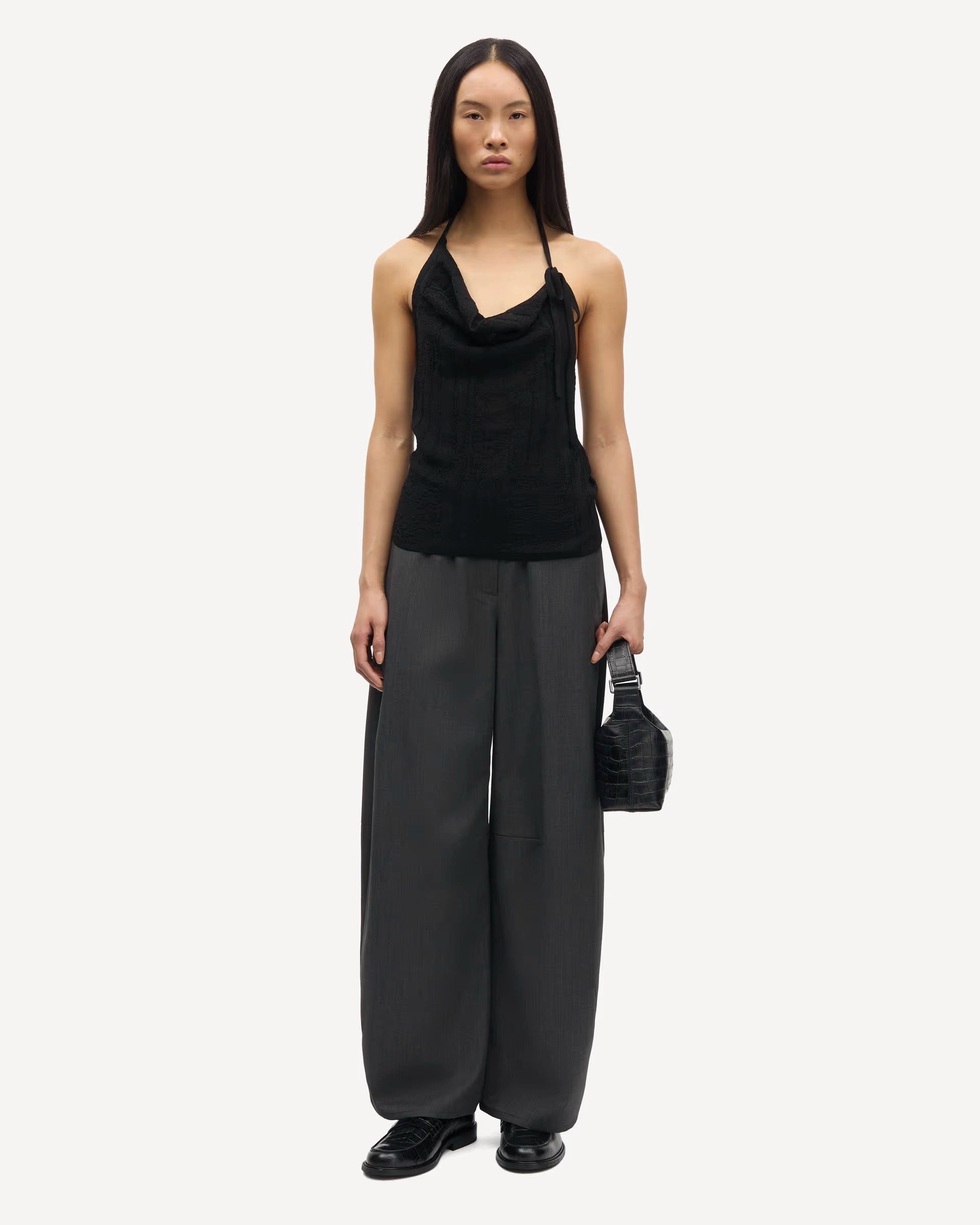 woman wearing grey high-waisted Saroko pants by Samsøe Samsøe