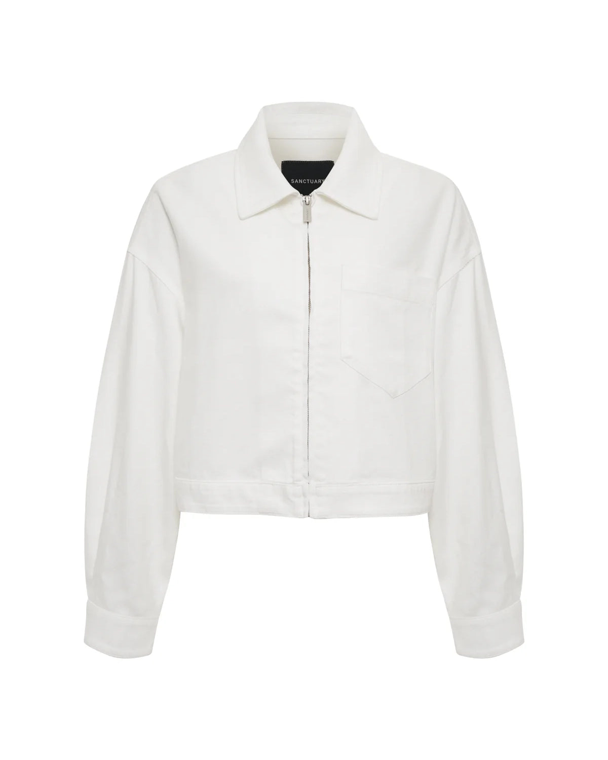 Woman wearing a white cropped zip jacket