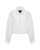 Woman wearing a white cropped zip jacket