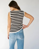 Woman wearing a crochet knit black and white striped sleeveless top 