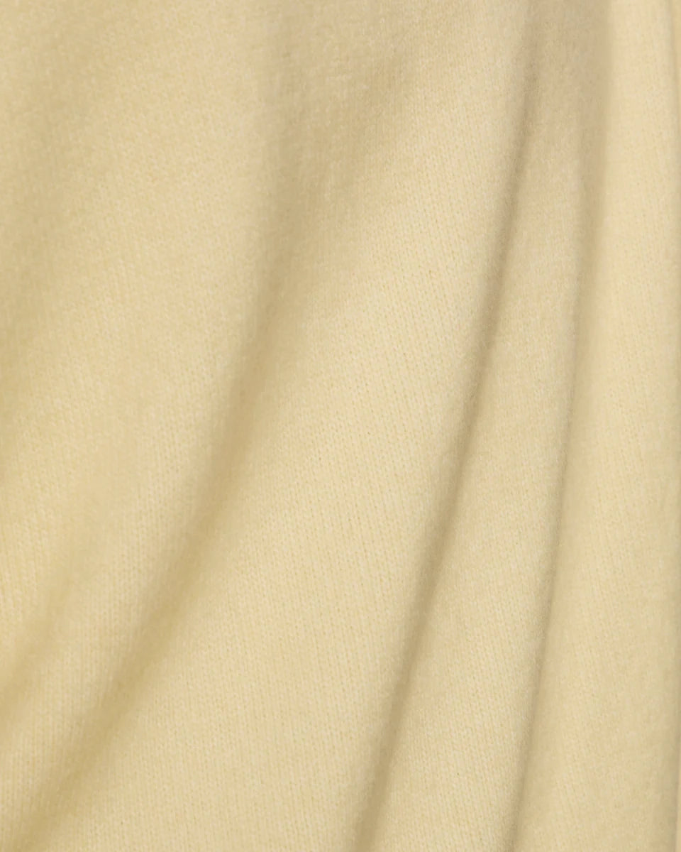 a light yellow oversized cashmere tee sweater