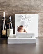 set of pinch bowls made out of wood sitting on table tray and shown with bottles of wine for entertaining