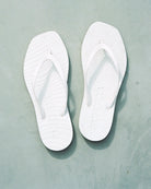 Pair of white flip-flop sandals by Sleepers