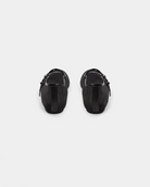a black ballerina flat that is mesh and has a strap going across the foot with meal holes and a buckle