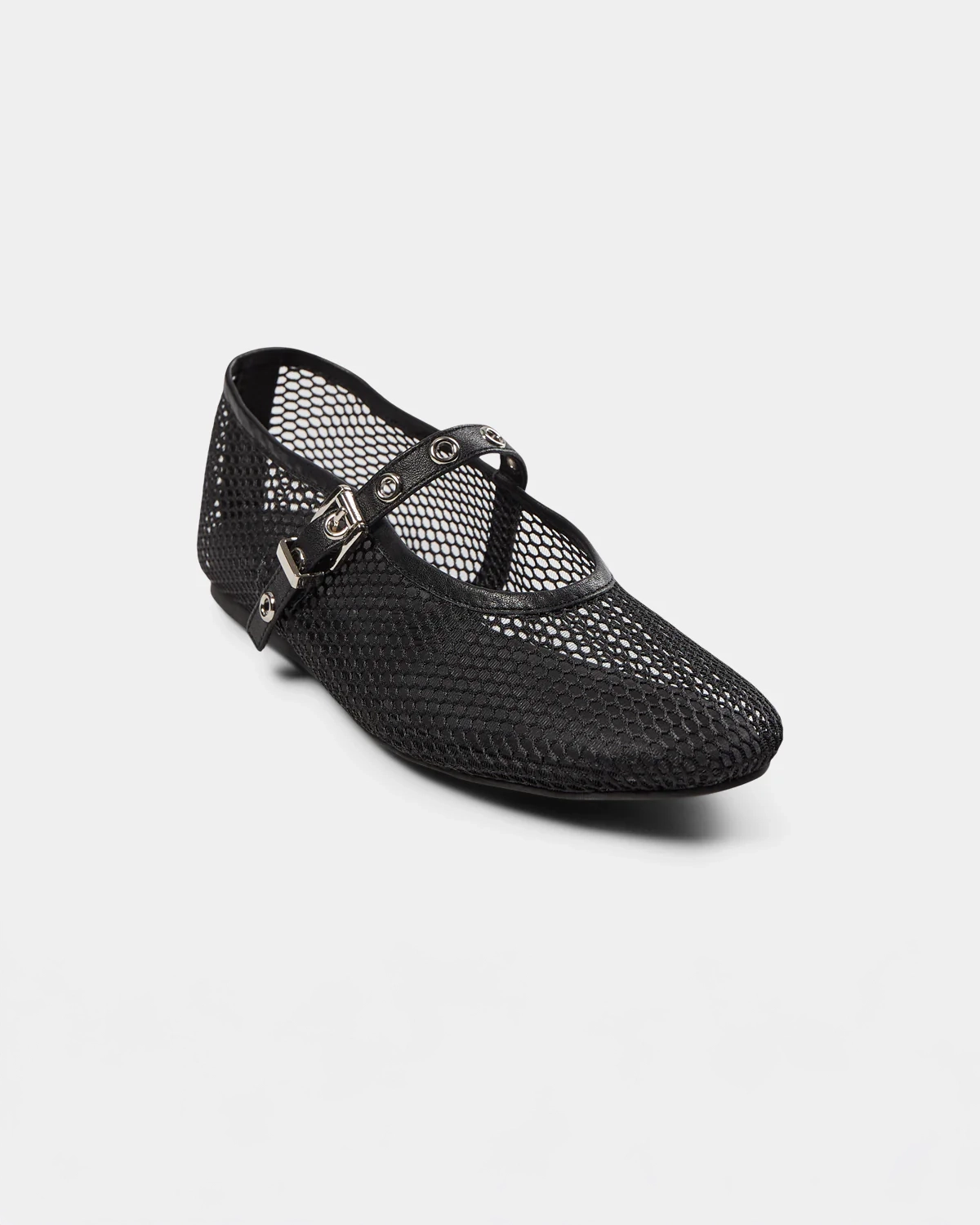 a black ballerina flat that is mesh and has a strap going across the foot with meal holes and a buckle