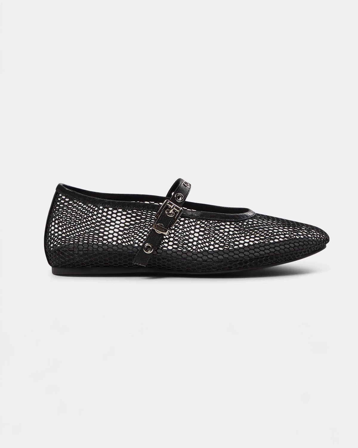 a black ballerina flat that is mesh and has a strap going across the foot with meal holes and a buckle