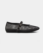 a black ballerina flat that is mesh and has a strap going across the foot with meal holes and a buckle