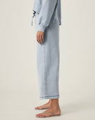 person wearing light blue grey terry pants with drawstring and elastic waistband