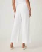 woman wearing white wide-leg terry cloth drawstring pants 