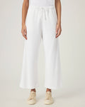 woman wearing white wide-leg terry cloth drawstring pants 