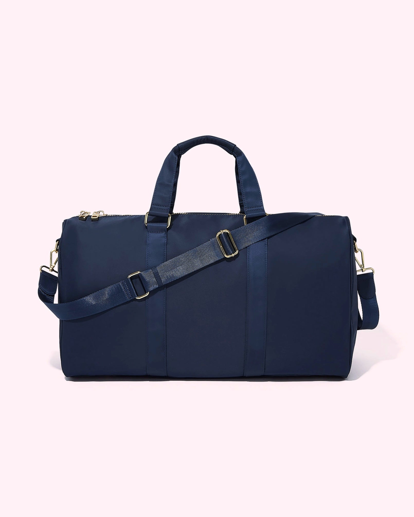 Navy blue duffel bag with gold accents by Stoney Clover Lane