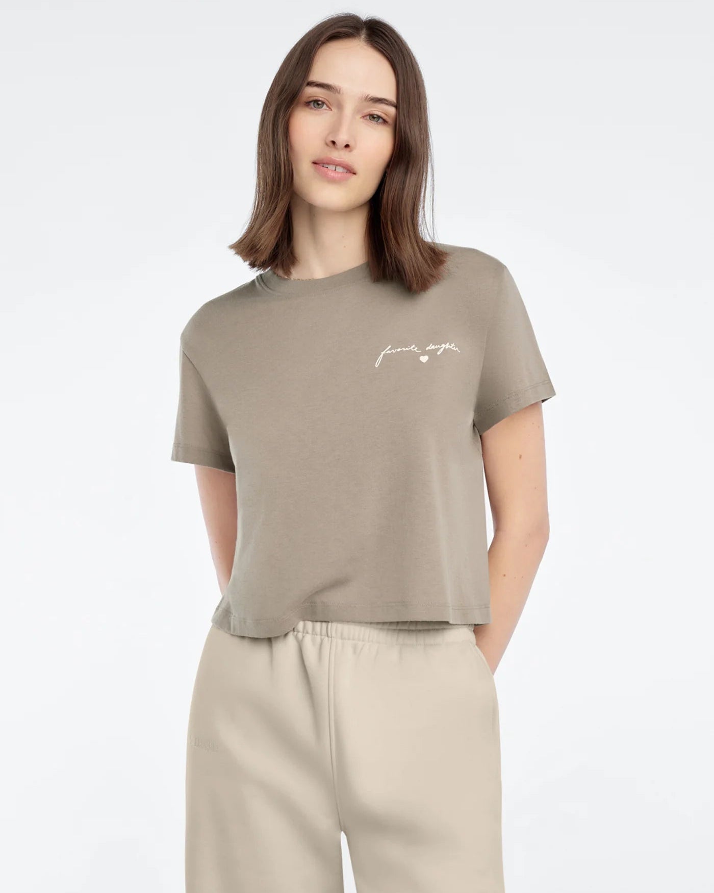 t-shirt in light brown with favorite daughter written on side of chest