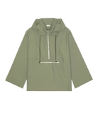 green rain jacket with wide sleeves and a hood
