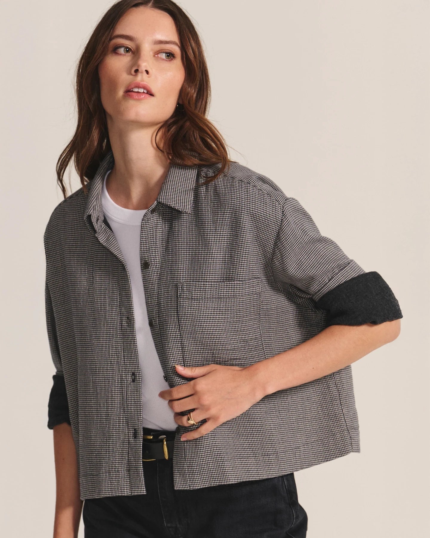 Woman wearing a gray checkered shirt