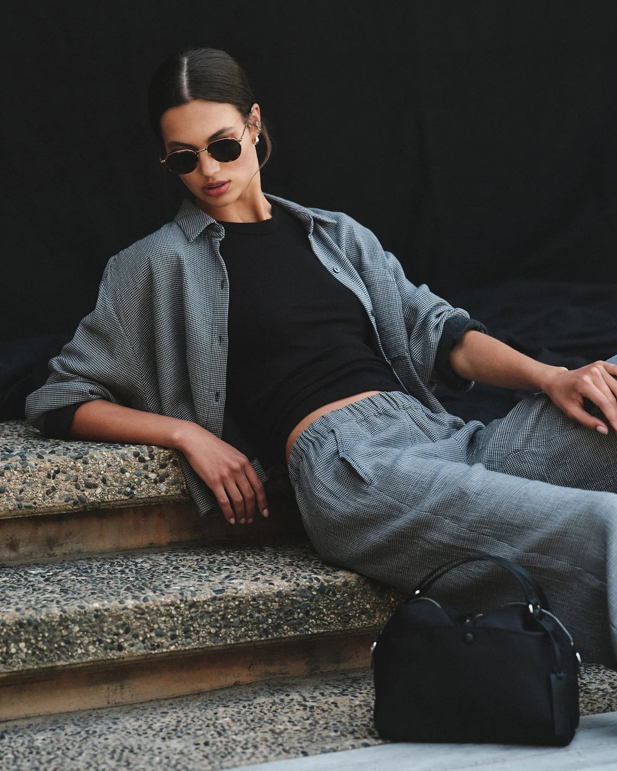 Woman wearing a gray checkered shirt