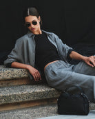 Woman wearing a gray checkered shirt