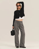 Person wearing gray wide-leg pants