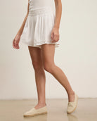 woman wearing white eyelet lace shorts 