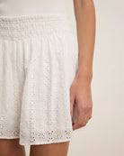 woman wearing white eyelet lace shorts 