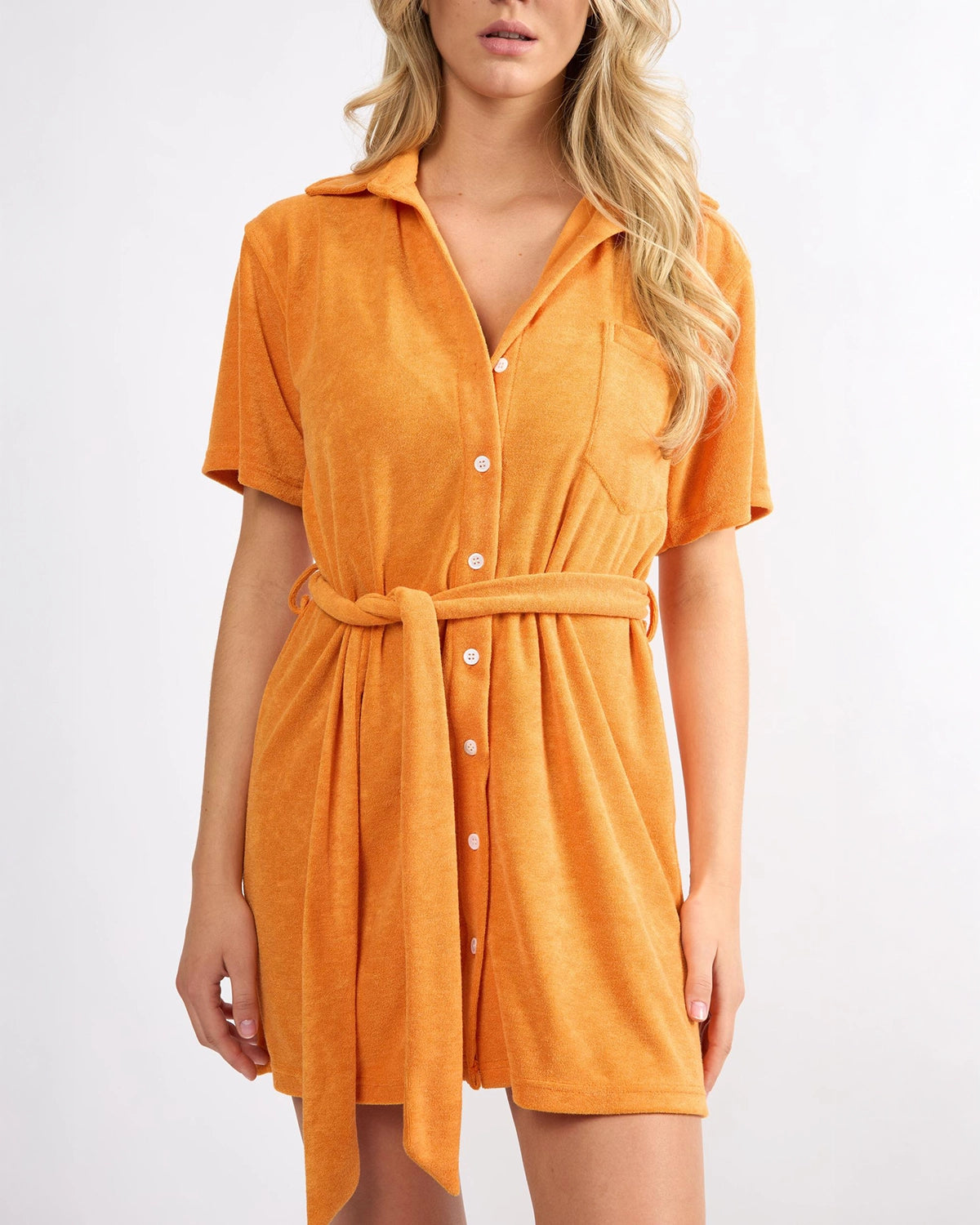 woman wearing short terry cloth cover up dress in bright orange by viens avec moi 