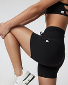 woman wearing black athletic shorts