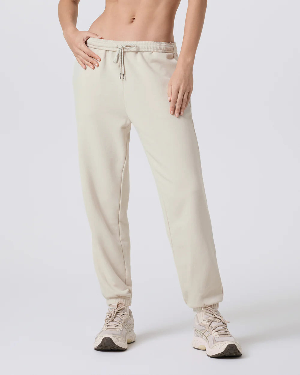 woman wearing beige sweatpants