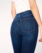 woman wearing skinny blue jeans in medium wash