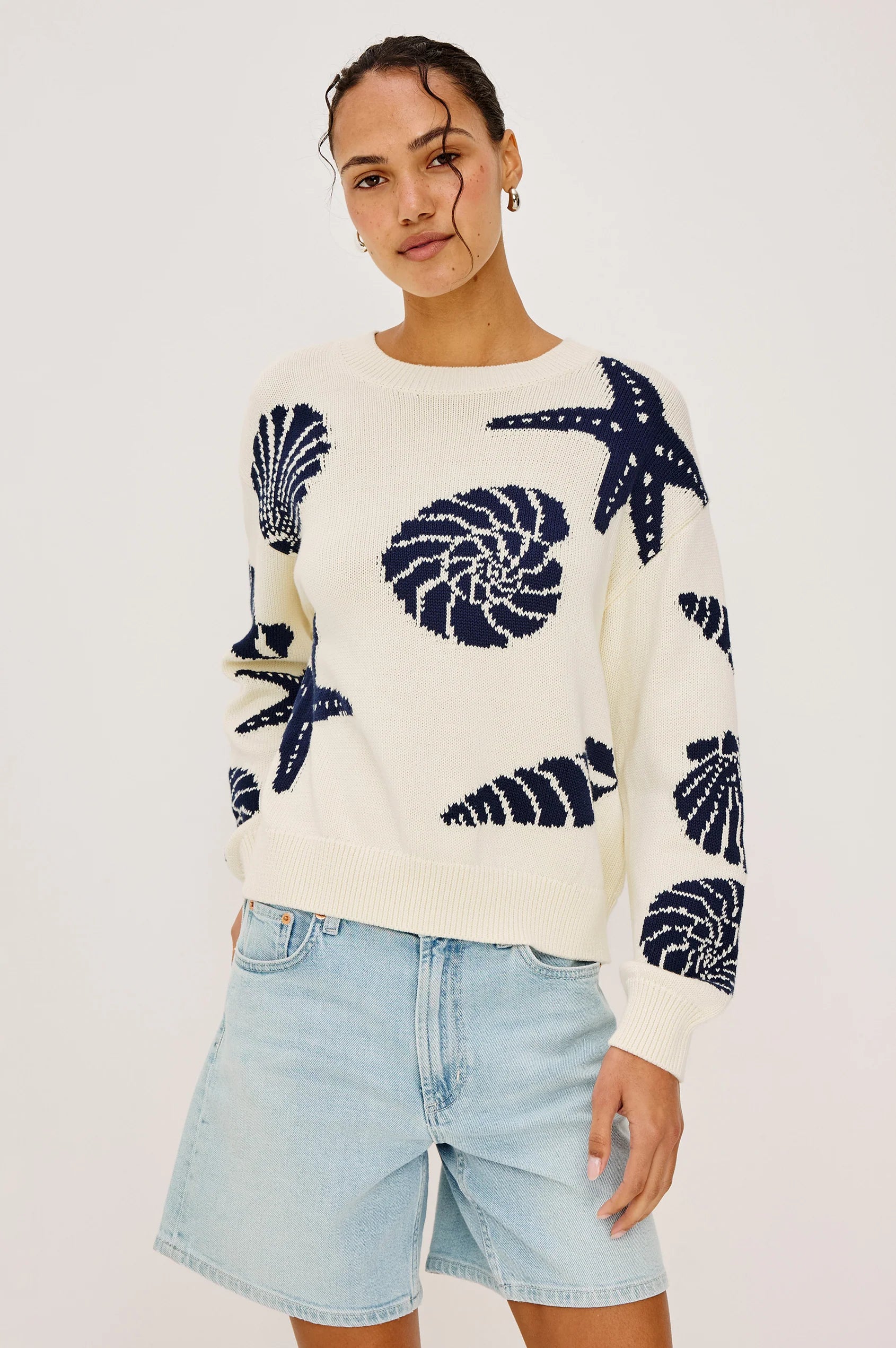 cream sweater with blue seashells all over