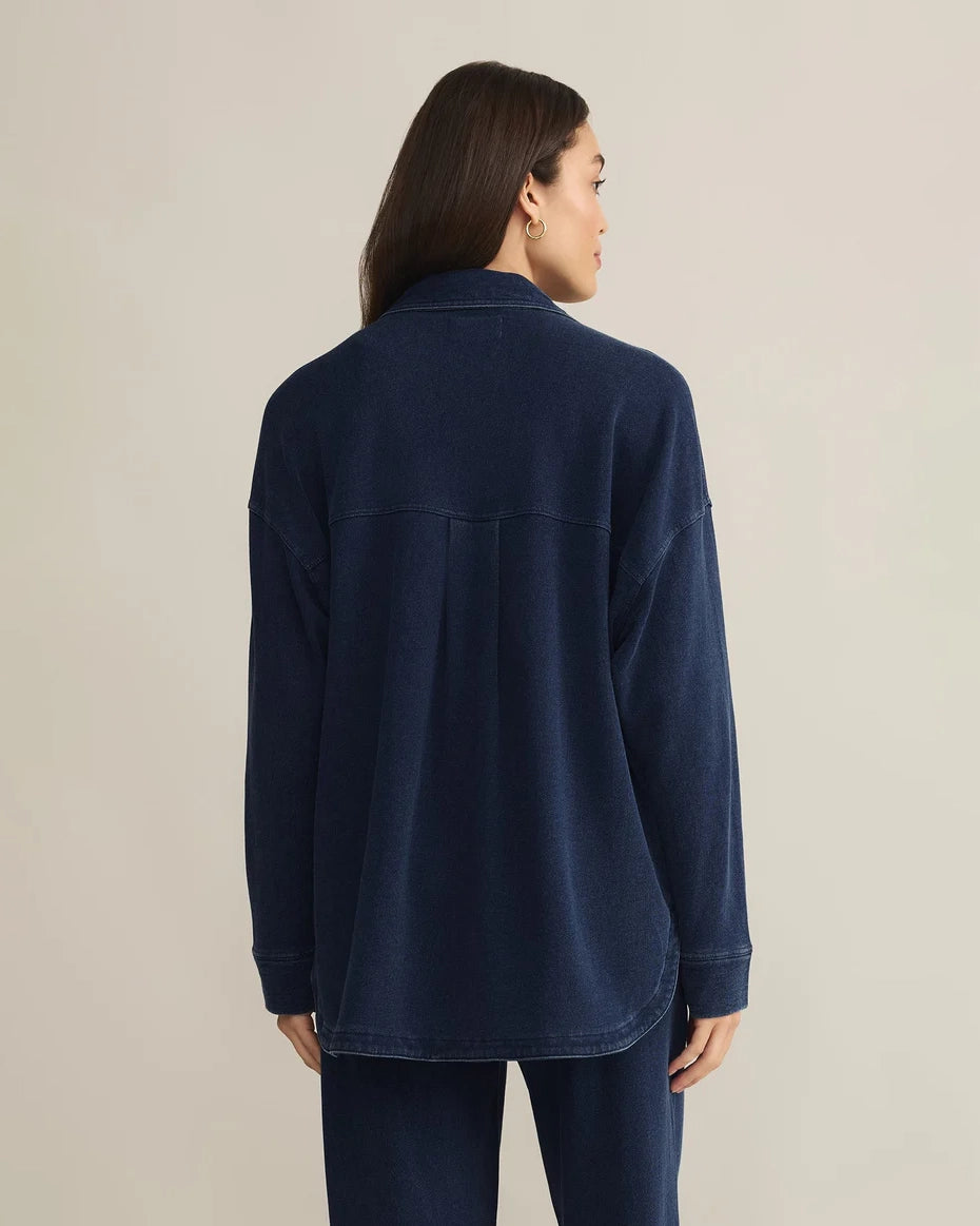 Woman wearing a blue denim button down jacket 