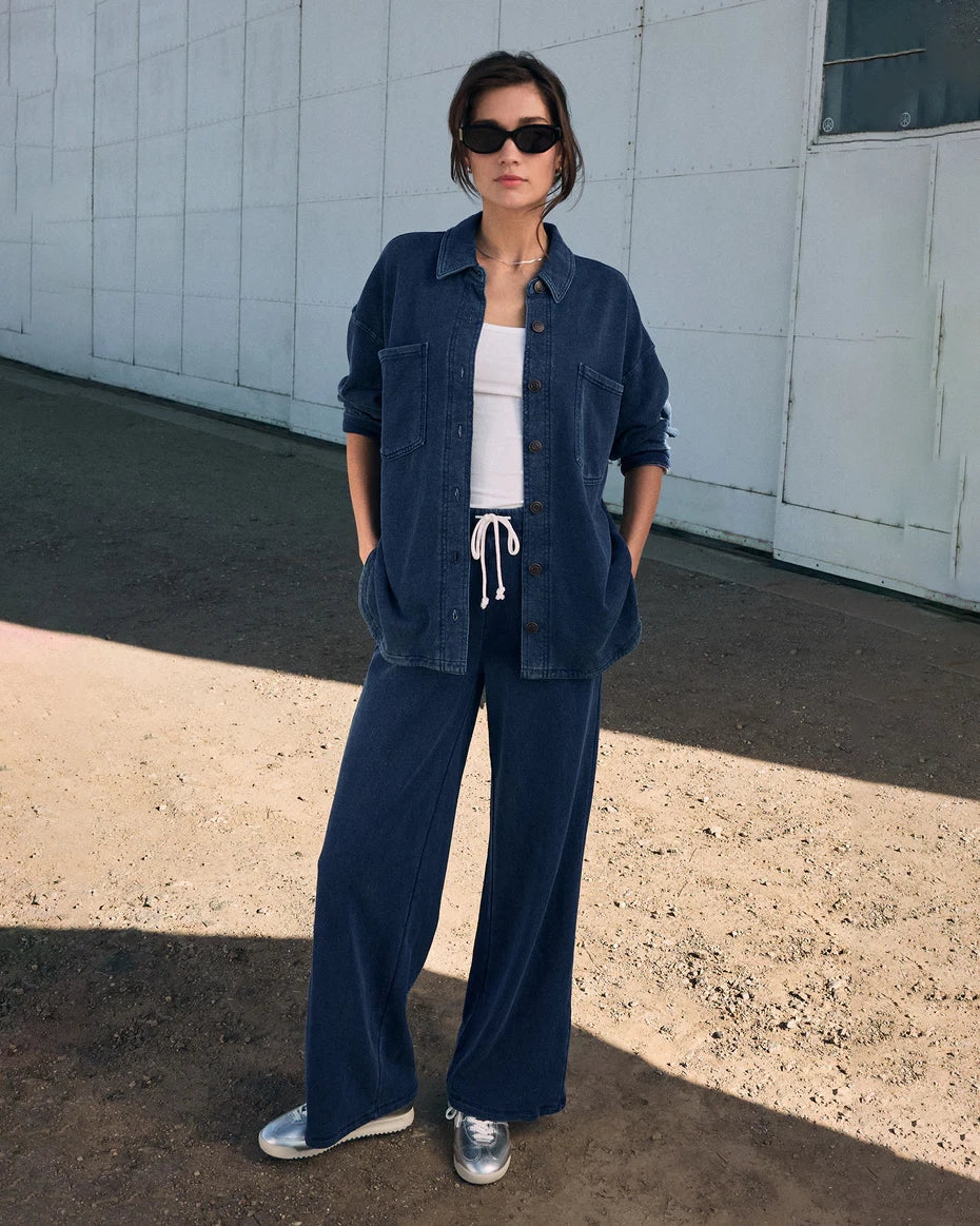 Person wearing a denim shirt and drawstring denim pant by Z Supply