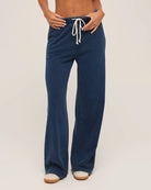 woman wears a blue drawstring denim pant by Z Supply
